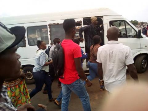 Commuters in wellington scramble for a place in a minibus 