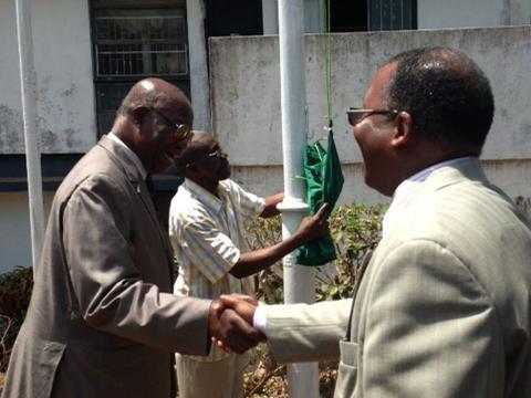 Pro-Chancellor, USL, Dr. Modupe Taylor-Pearce (L) shaking hands with Vice Chancellor &amp; Principal, USL, Prof. Jonas Redwood-Sawyerr before hoisting the FBC flag. 