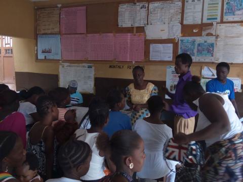 Pregnant women and lactating mothers listening an ANC session at a government hospital in Freetown