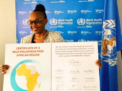 WHO Regional Director for Africa, Dr Moeti displays the certificate